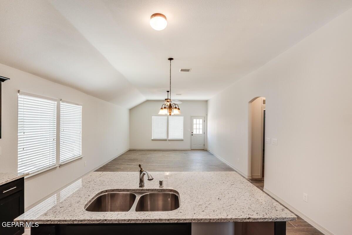 513 Caddo Lane Clint, TX 79836 - Photo 11 of 28 a kitchen with sink refrigerator and window