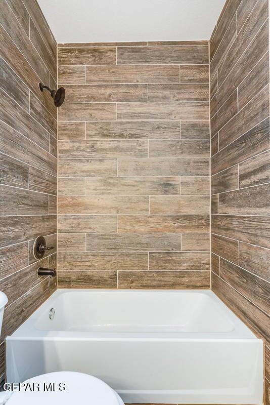 513 Caddo Lane Clint, TX 79836 - Photo 16 of 28 a bathroom with a shower and a bathtub