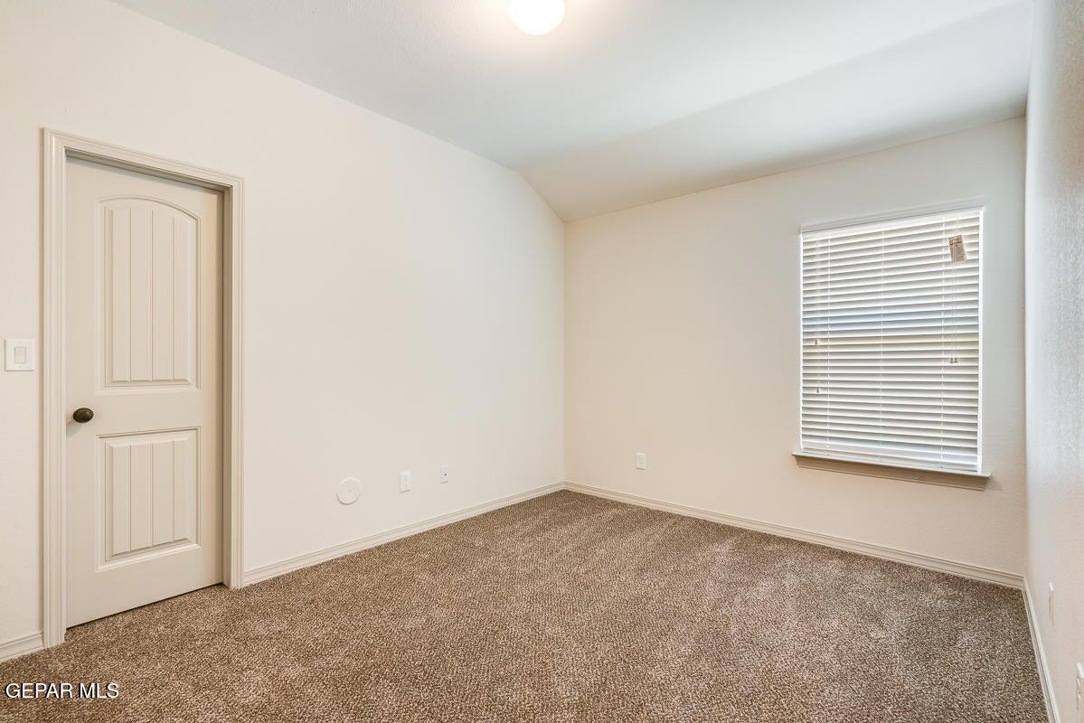 513 Caddo Lane Clint, TX 79836 - Photo 17 of 28 an empty room with windows