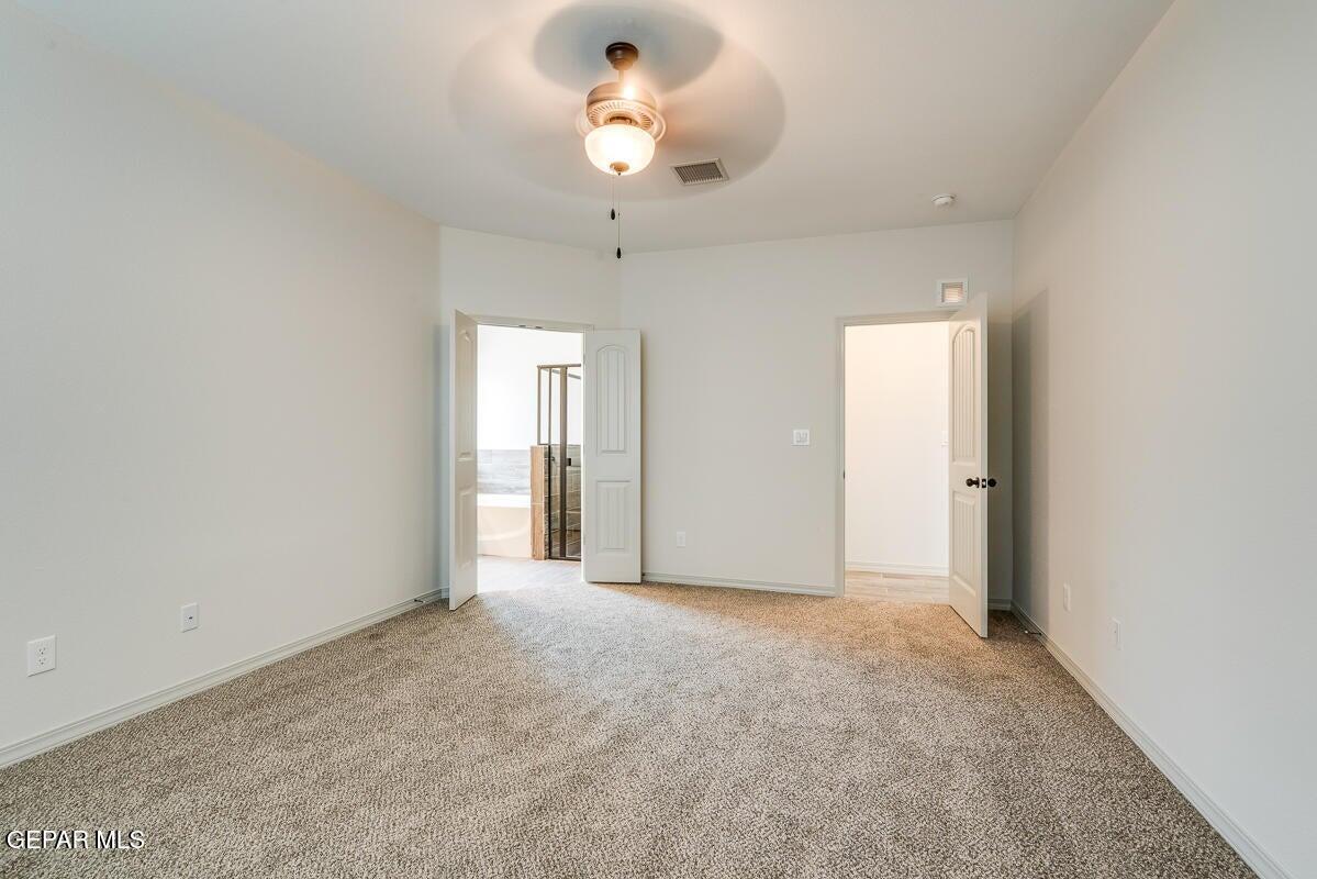 513 Caddo Lane Clint, TX 79836 - Photo 22 of 28 a view of an empty room with a window
