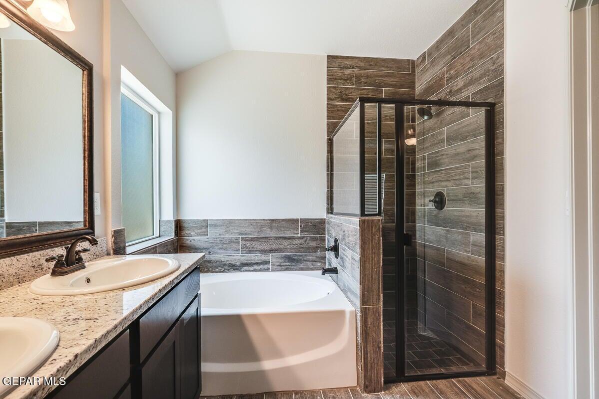 513 Caddo Lane Clint, TX 79836 - Photo 26 of 28 a bathroom with a granite countertop sink and mirror