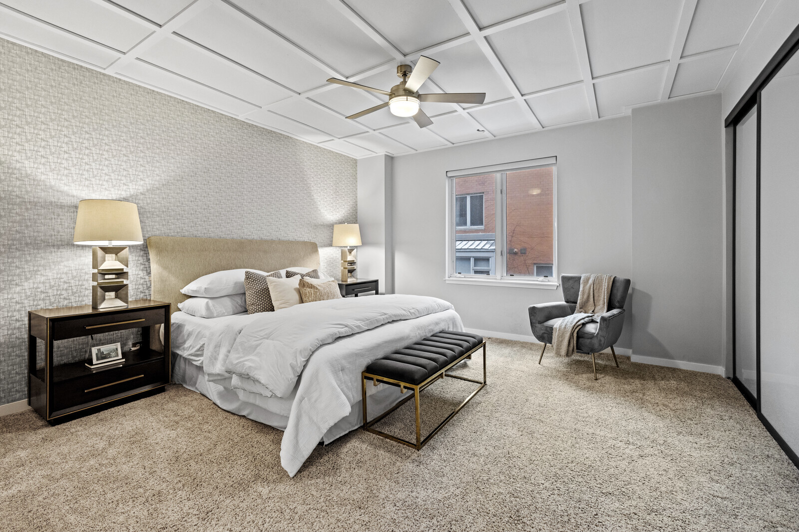 16 North May Street, Unit 511 Chicago, IL 60607 - Photo 14 of 26 a spacious bedroom with a bed a table and a chandelier