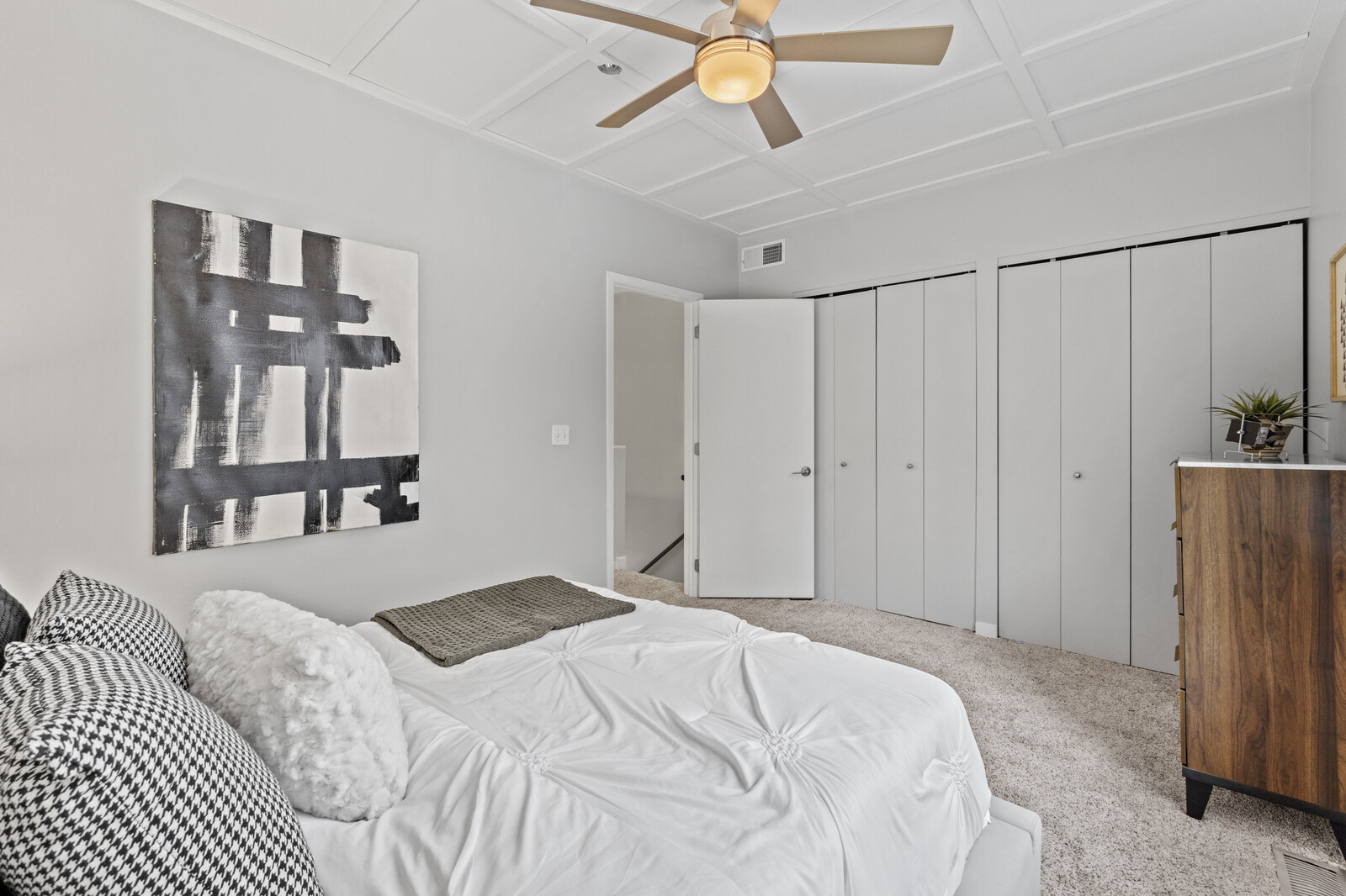 16 North May Street, Unit 511 Chicago, IL 60607 - Photo 17 of 26 a bedroom with a large bed and a chandelier