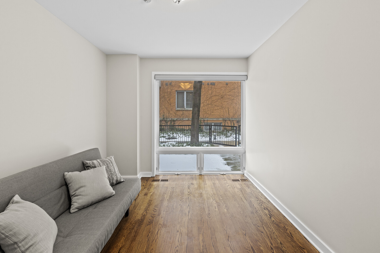 16 North May Street, Unit 511 Chicago, IL 60607 - Photo 19 of 26 a living room with furniture and a large window