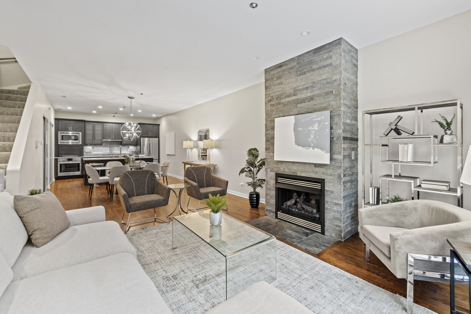 16 North May Street, Unit 511 Chicago, IL 60607 - Photo 2 of 26 a living room with furniture and a fireplace