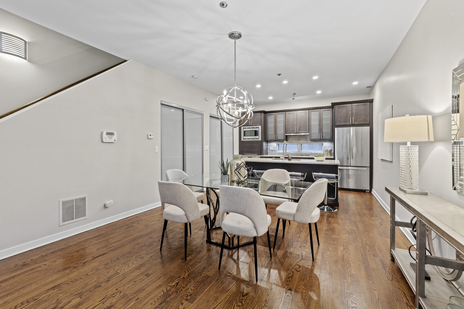 16 North May Street, Unit 511 Chicago, IL 60607 - Photo 6 of 26 a view of a dining room with furniture and wooden floor