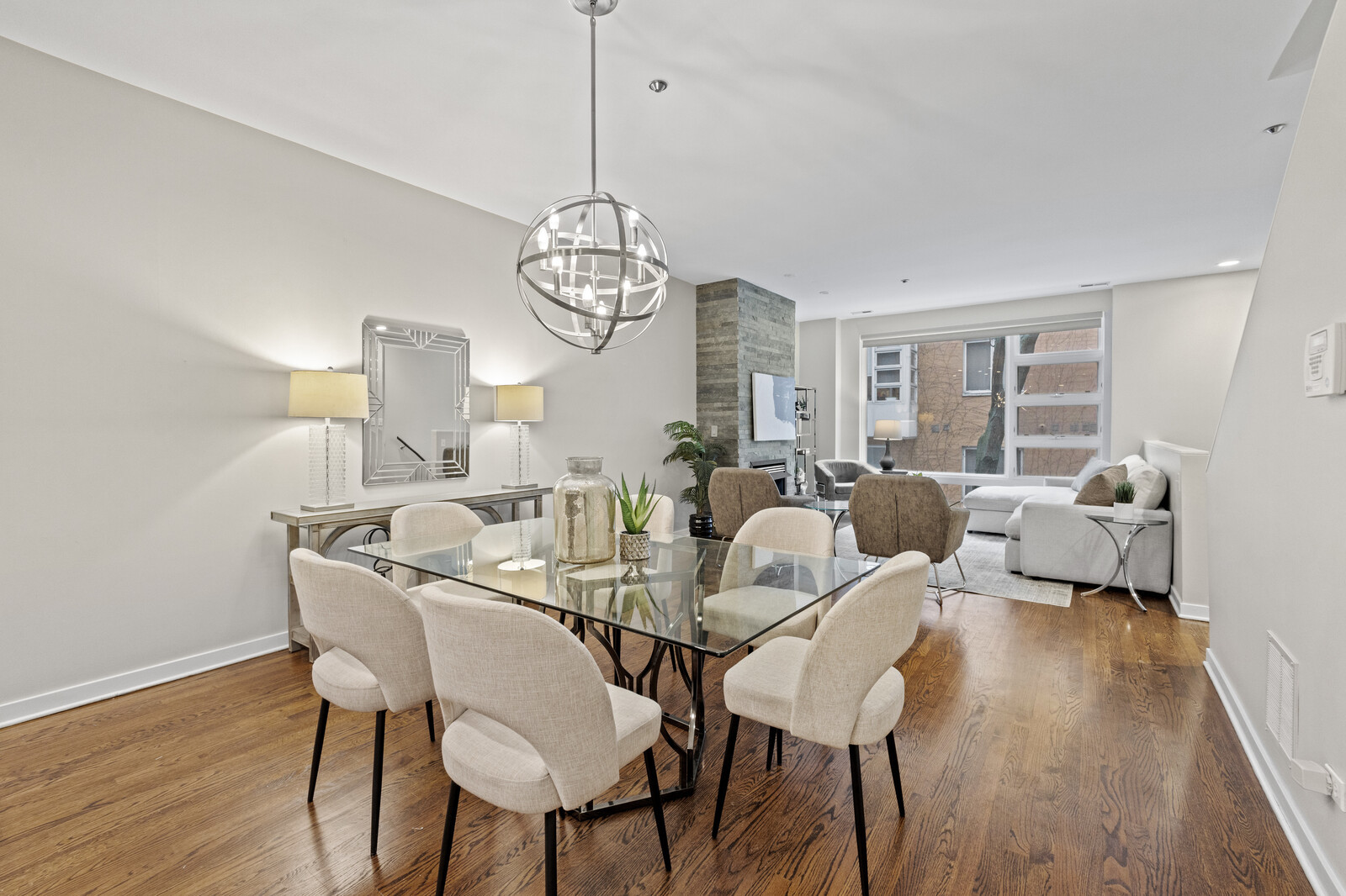 16 North May Street, Unit 511 Chicago, IL 60607 - Photo 9 of 26 a view of a dining room with furniture wooden floor and chandelier