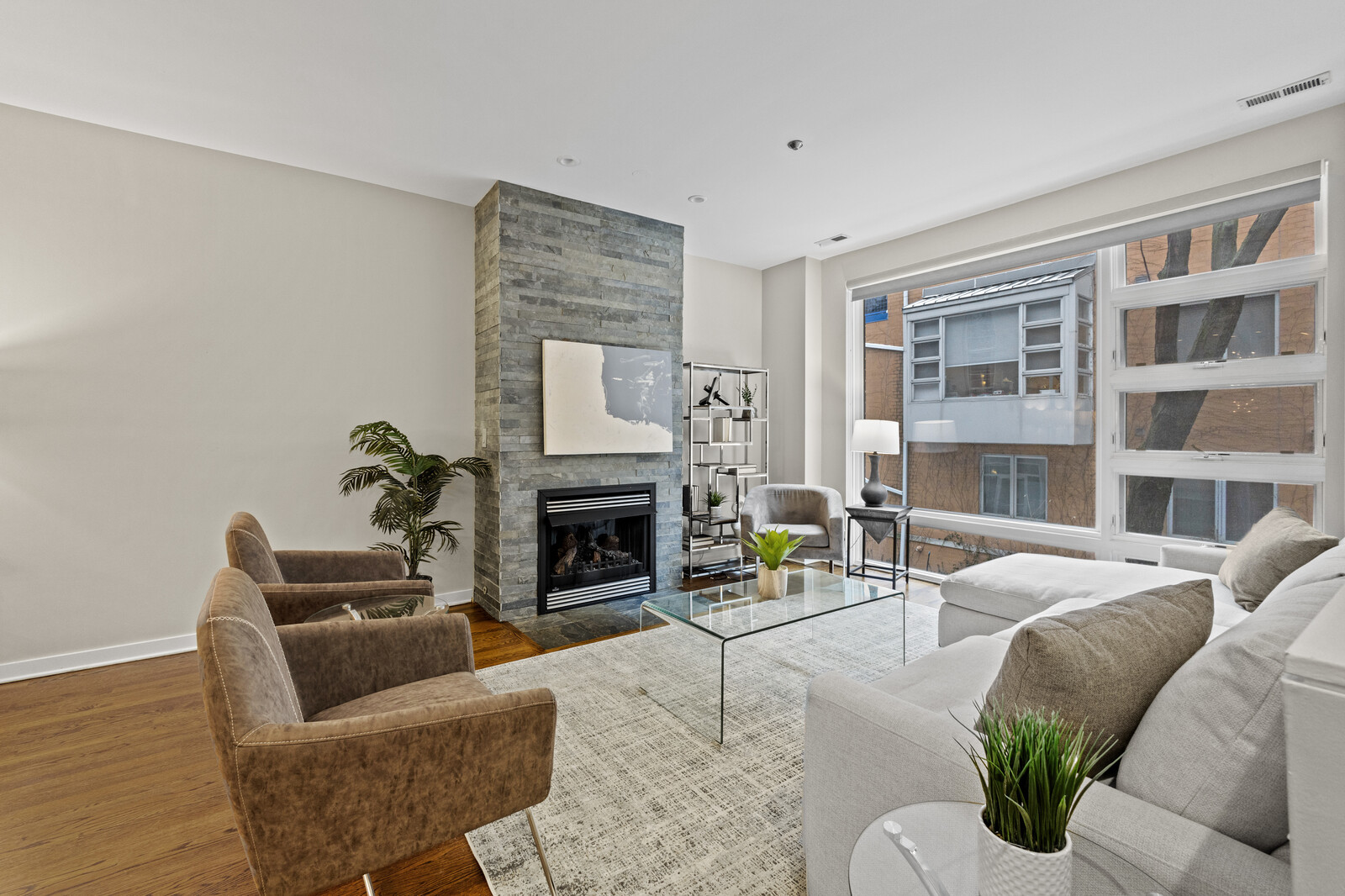 16 North May Street, Unit 511 Chicago, IL 60607 - Photo 10 of 26 a living room with furniture and a fireplace