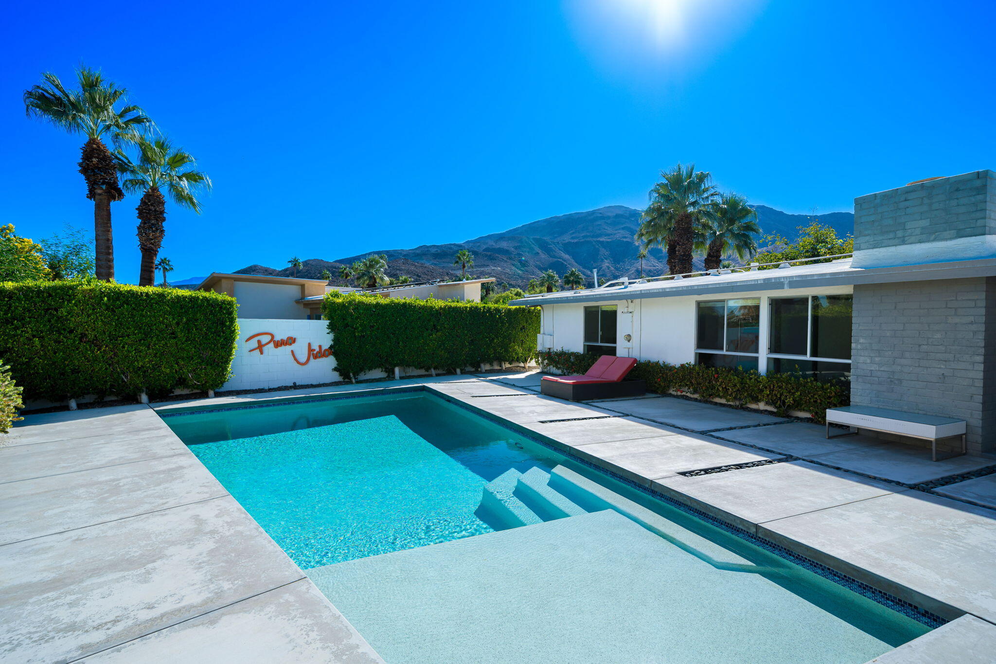 71718 Tunis Road Rancho Mirage, CA 92270 - Photo 28 of 43 a view of house with swimming pool outdoor seating