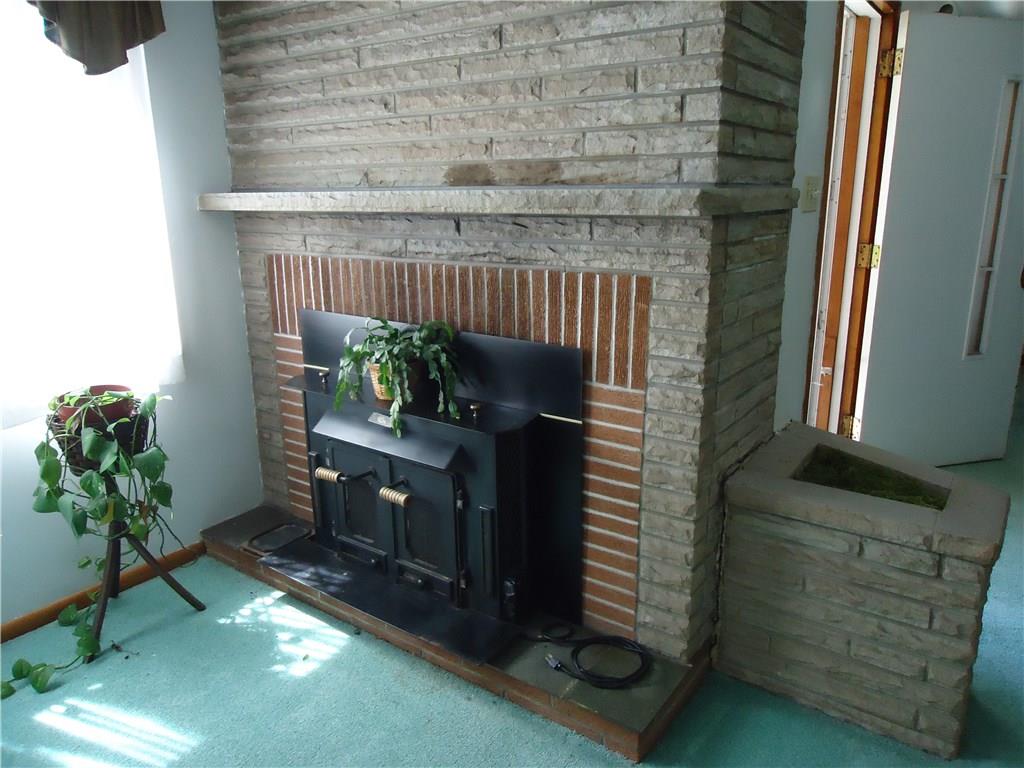 1820 Dutch Ridge Road Beaver, PA 15009 - Photo 3 of 24 Stone fireplace with wood burning insert.