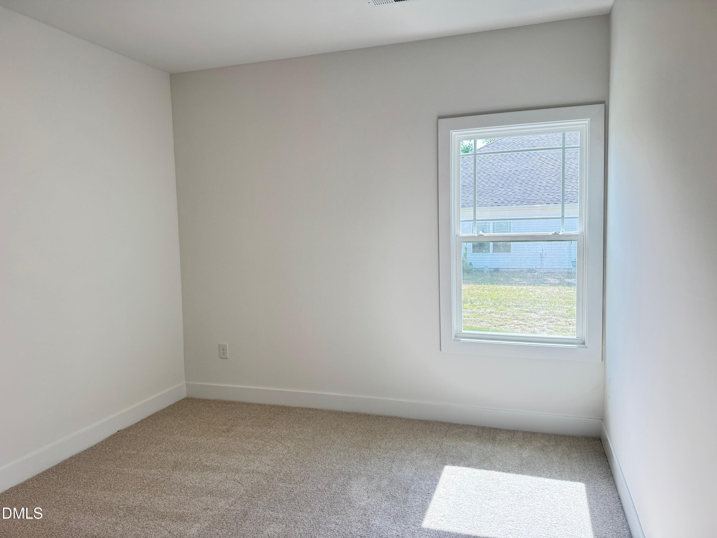 20 Streamline Court Lillington, NC 27546 - Photo 20 of 46 an empty room with a window