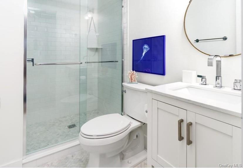 800 Dune Road Westhampton Beach, NY 11978 - Photo 16 of 19 a bathroom with a sink a toilet and shower