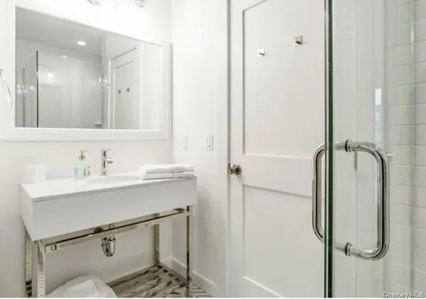 a bathroom with a sink and mirror