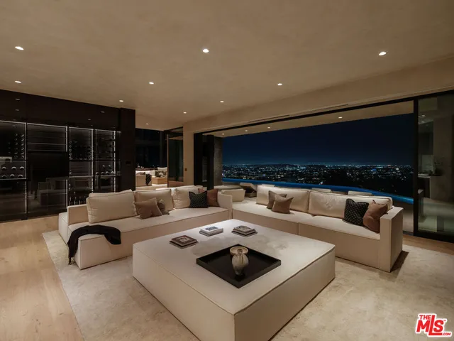 a bathroom with a granite countertop sink a mirror and shower