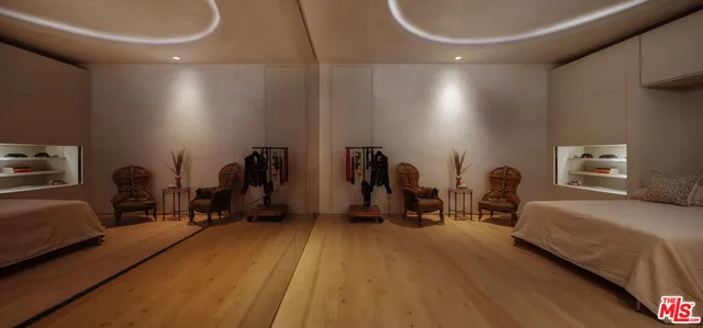 a view of a hall with wooden floor and a hallway