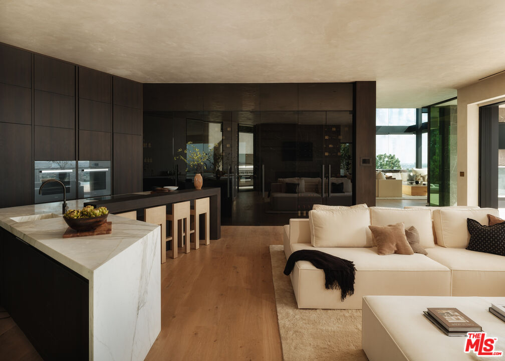 9126 Cordell Drive Los Angeles, CA 90069 - Photo 8 of 27 a living room with furniture and a wooden floor