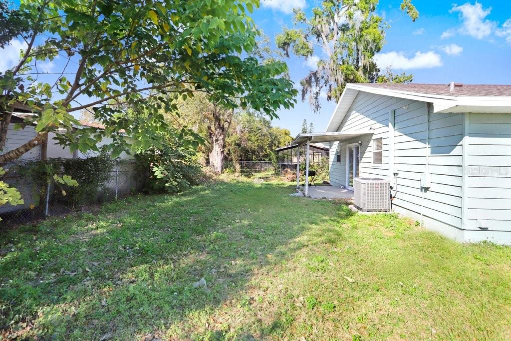 903 North Park Road Plant City, FL 33563 - Photo 22 of 28 a view of a house with a yard
