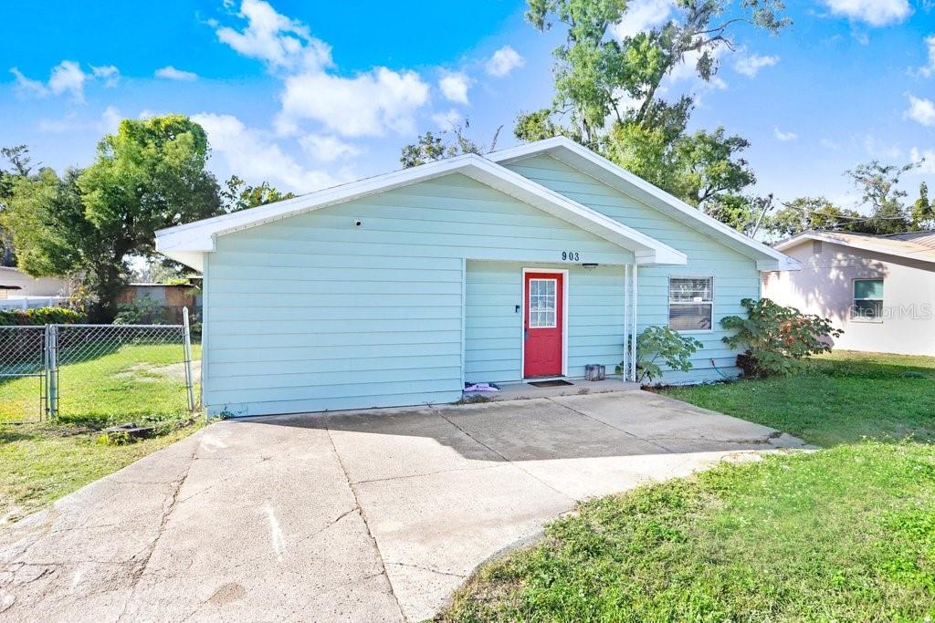 903 North Park Road Plant City, FL 33563 - Photo 28 of 28 a view of a house with a yard and potted plants