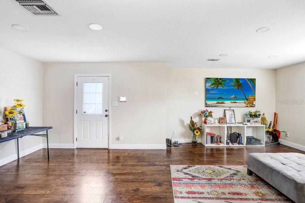 903 North Park Road Plant City, FL 33563 - Photo 4 of 28 a living room with furniture and wooden floor