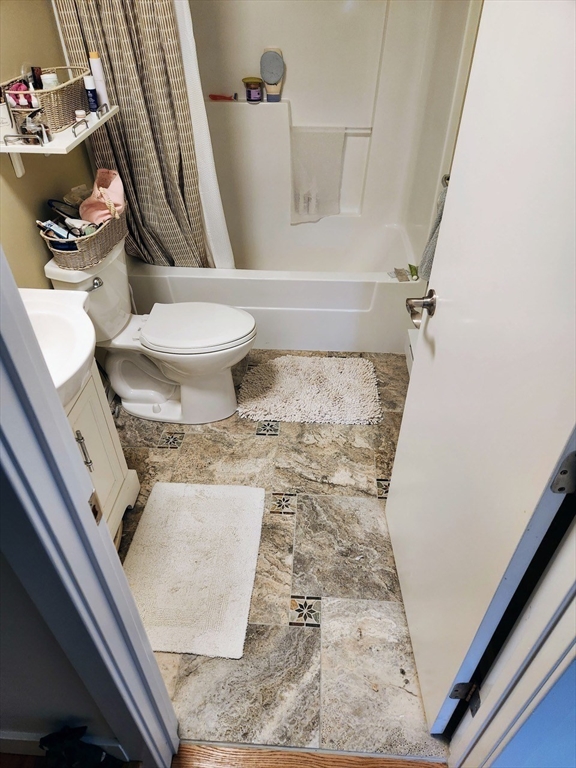11 Low Street, Unit 1 Newbury, MA 01951 - Photo 13 of 14 a bathroom with a sink and toilet
