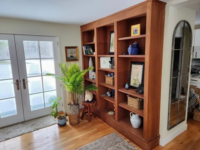 a view of living room with furniture and book shelf