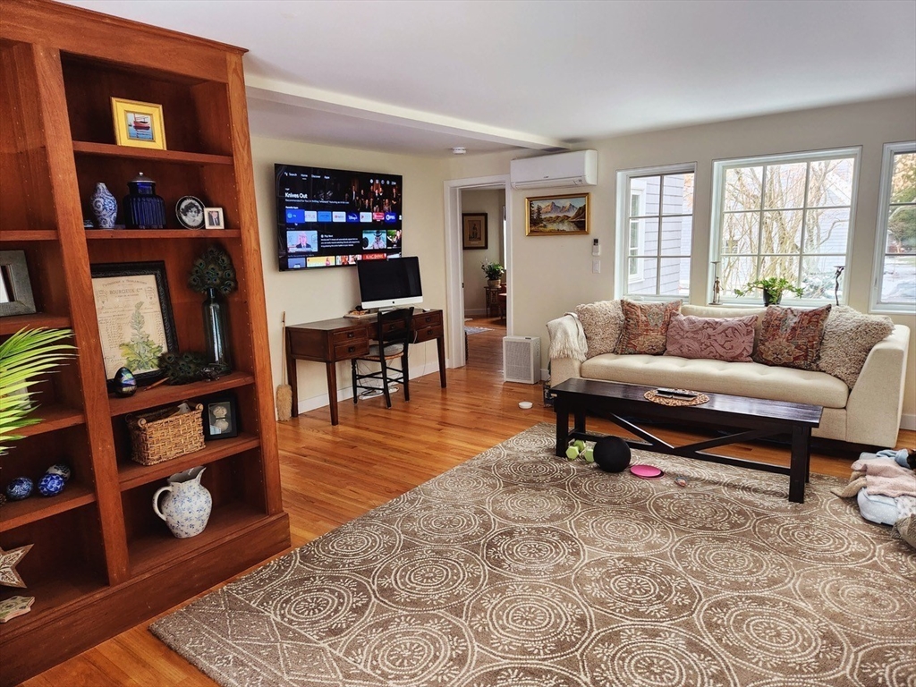 11 Low Street, Unit 1 Newbury, MA 01951 - Photo 5 of 14 a living room with furniture a rug and a window