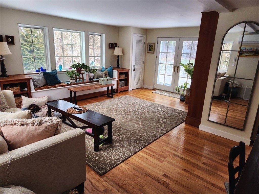 11 Low Street, Unit 1 Newbury, MA 01951 - Photo 7 of 14 a living room with furniture rug and wooden floor