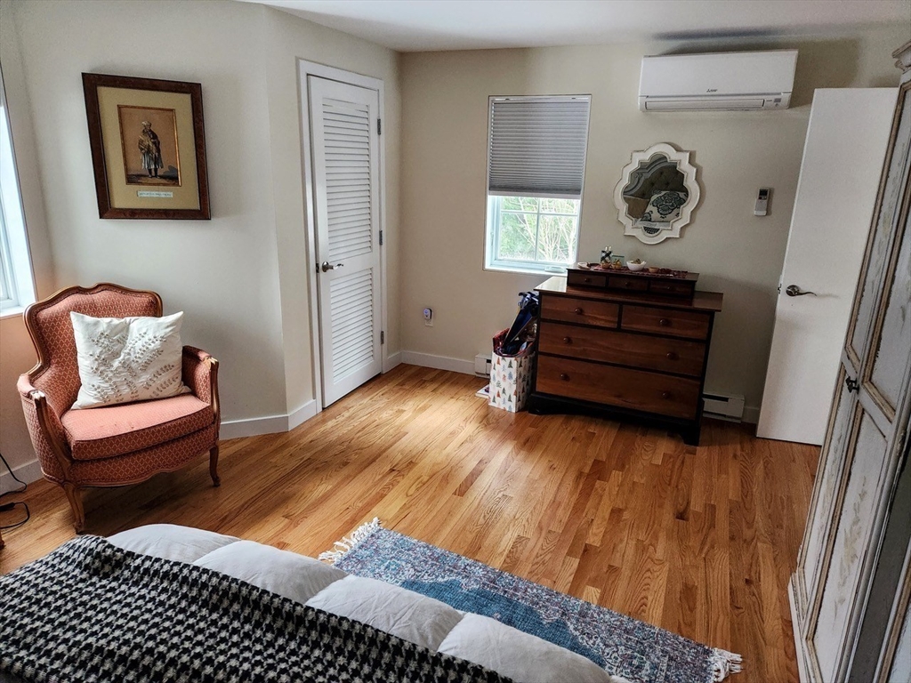 11 Low Street, Unit 1 Newbury, MA 01951 - Photo 10 of 14 a living room with furniture and a window