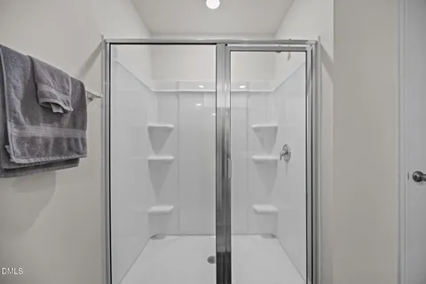 a bathroom with 2 sink and a mirror