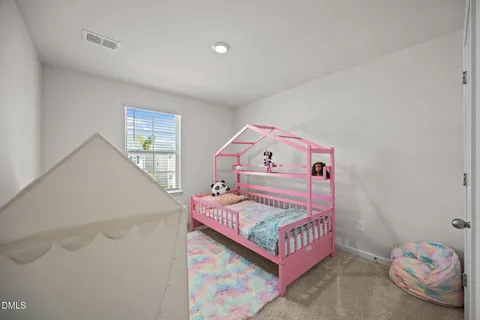 a view of a room with furniture and toys