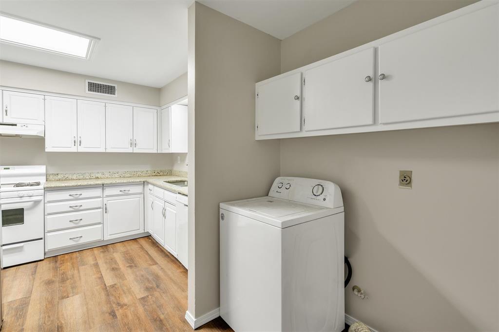 209 Mistletoe Lane Keene, TX 76059 - Photo 17 of 38 a kitchen with sink cabinets and white appliances