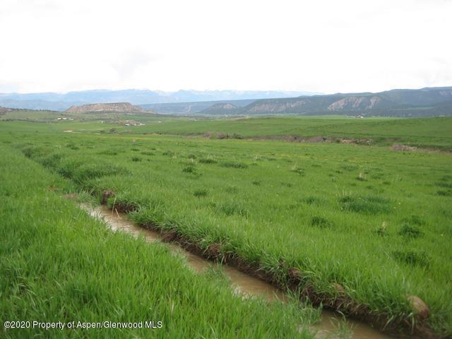331 County Road 331 Silt, CO 81652 - Photo 14 of 15 a view of a lush green hillside and a houses