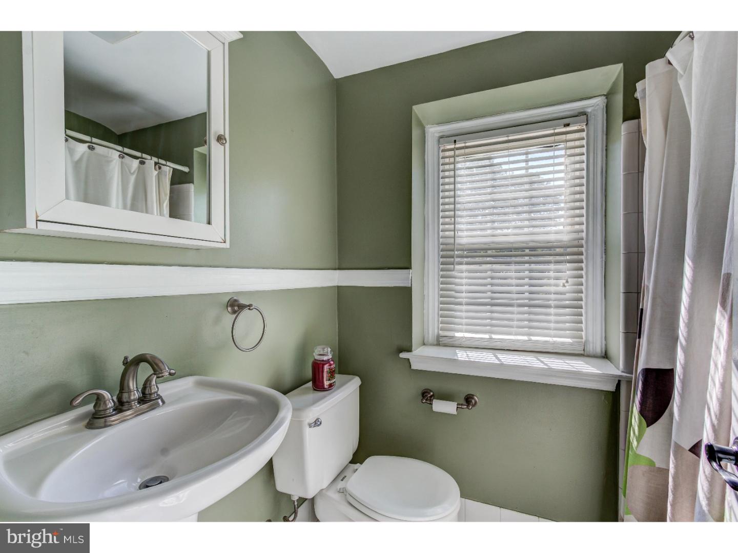 204 Pine Ridge Road Havertown, PA 19083 - Photo 17 of 24 a bathroom with a sink and a window