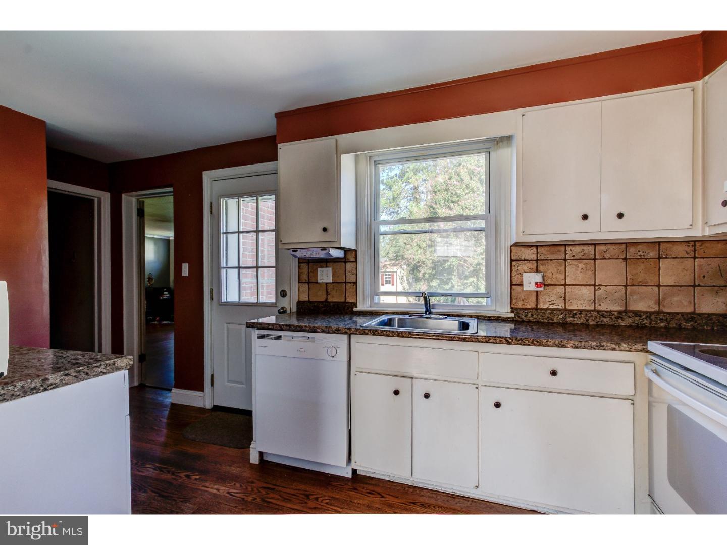 204 Pine Ridge Road Havertown, PA 19083 - Photo 5 of 24 a kitchen with stainless steel appliances granite countertop a sink a stove cabinets and a window