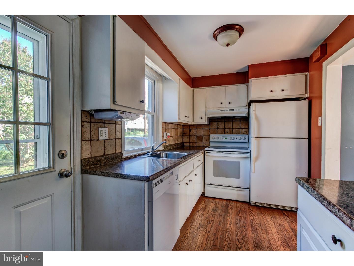 204 Pine Ridge Road Havertown, PA 19083 - Photo 6 of 24 a kitchen with stainless steel appliances granite countertop a refrigerator a stove a sink and a granite counter tops with a large window