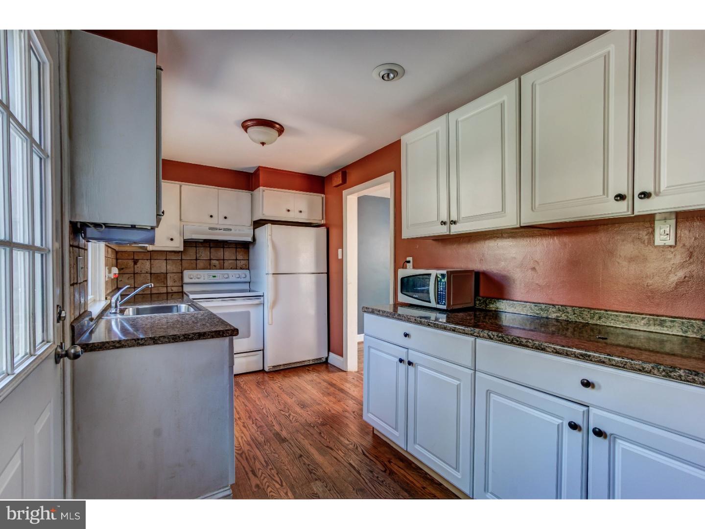 204 Pine Ridge Road Havertown, PA 19083 - Photo 7 of 24 a kitchen with stainless steel appliances granite countertop a sink stove and refrigerator