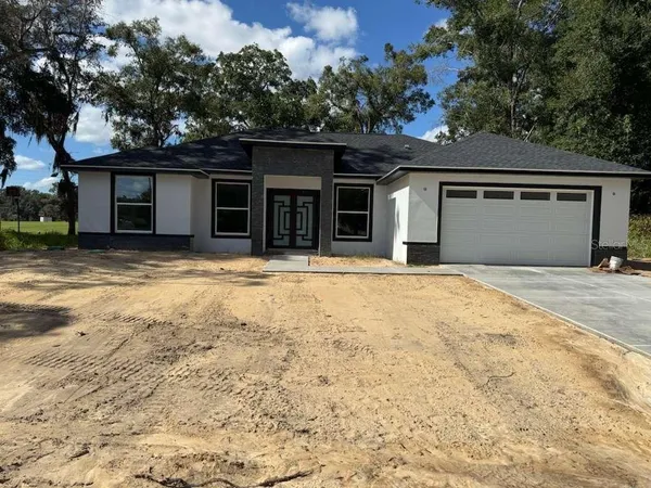 a house with trees in the background