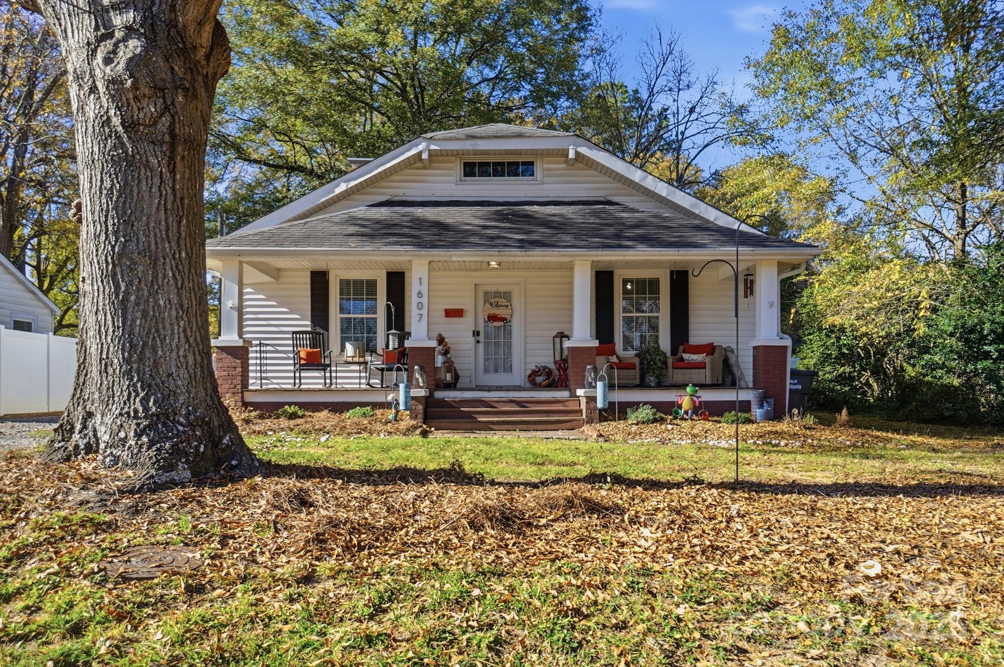 a view of a house with swimming pool and sitting area
