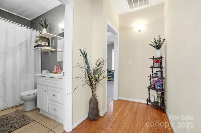 a view of bathroom with a sink and a mirror