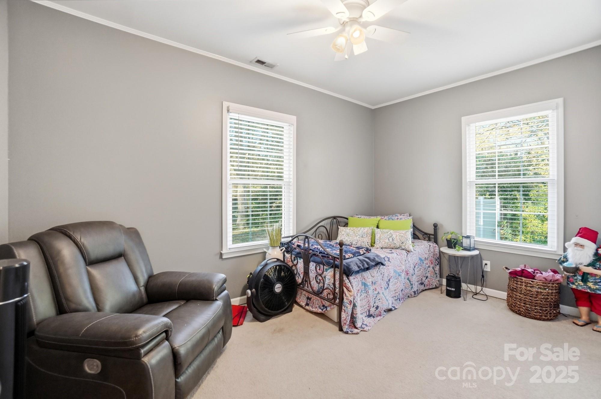 1607 Florida Street Gastonia, NC 28052 - Photo 21 of 24 a bedroom with furniture and a large window