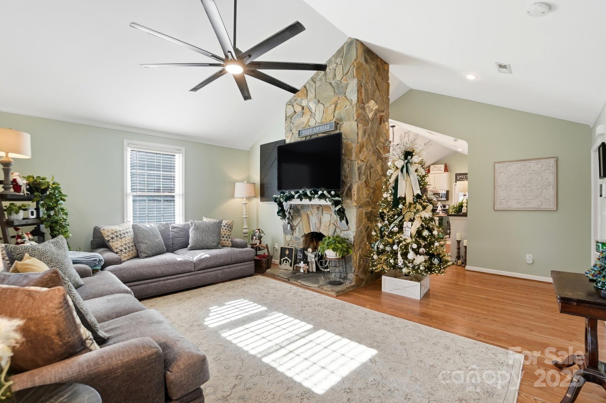 1607 Florida Street Gastonia, NC 28052 - Photo 5 of 24 a living room with furniture and a flat screen tv
