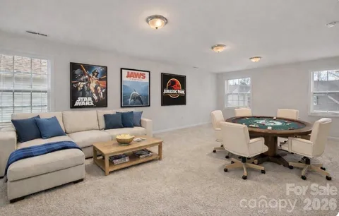 a living room with furniture and a table