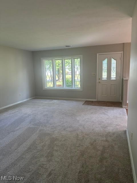 8136 Bellflower Road Mentor, OH 44060 - Photo 7 of 17 Unfurnished living room with carpet flooring and baseboards