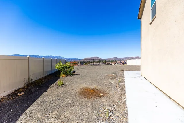 a view of a backyard of the house