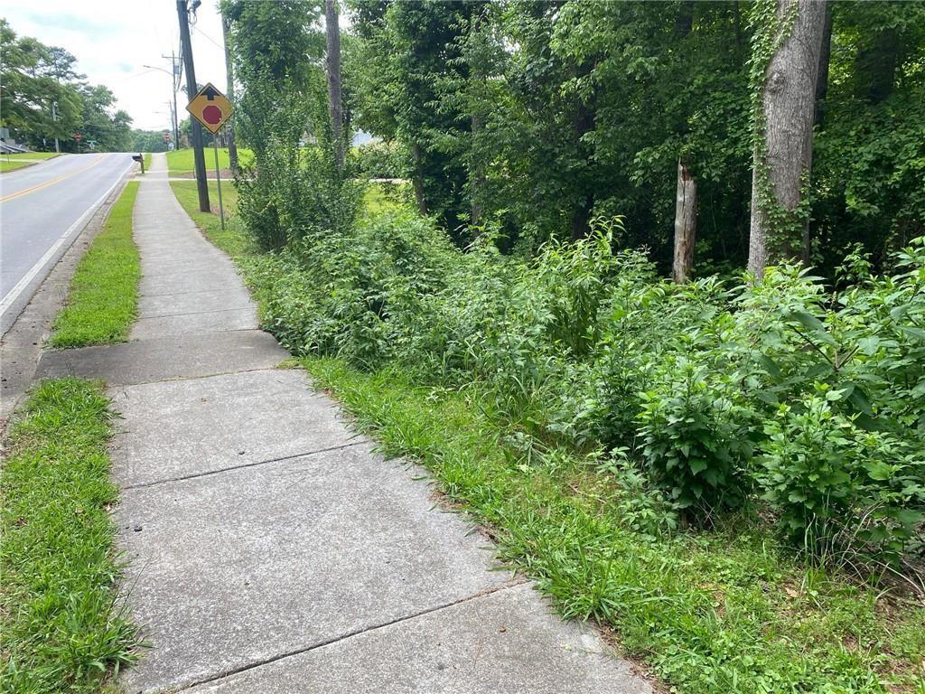 a view of a pathway with a park