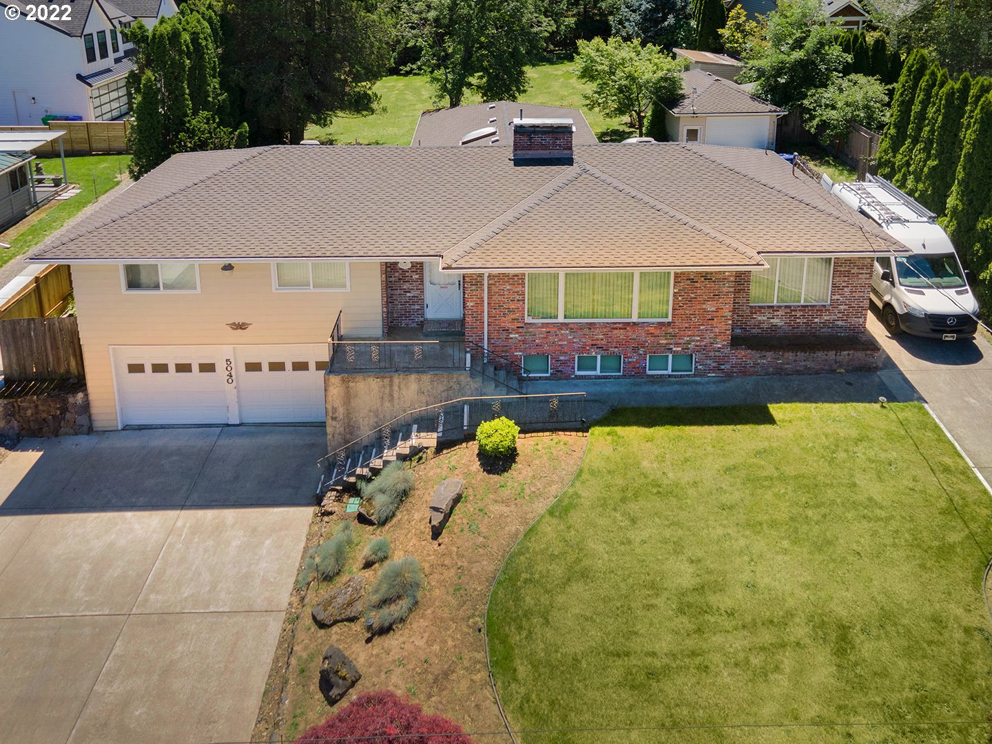 a aerial view of a house with swimming pool yard and patio