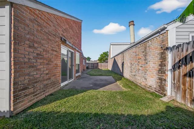 a view of pathway in front of house with wooden stairs