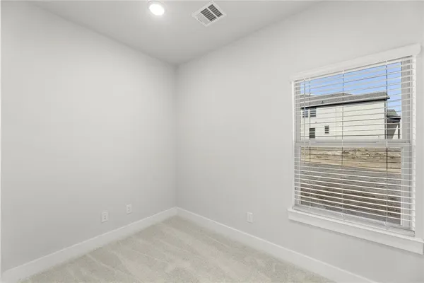 a view of a closet area with wooden floor