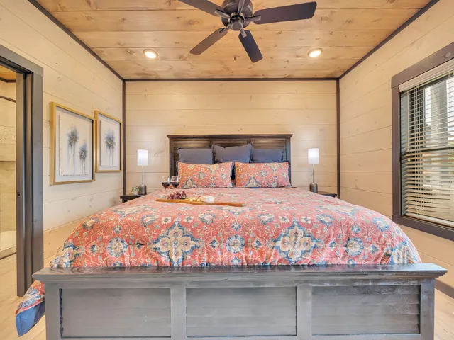 a bedroom with a bed and window