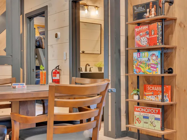 a living room with furniture and a ceiling fan
